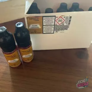 10 flacons Airmust Poire Caramel, neufs et scellés. • Saveur : poire caramel • Taux de nicotine : 12 mg/ml